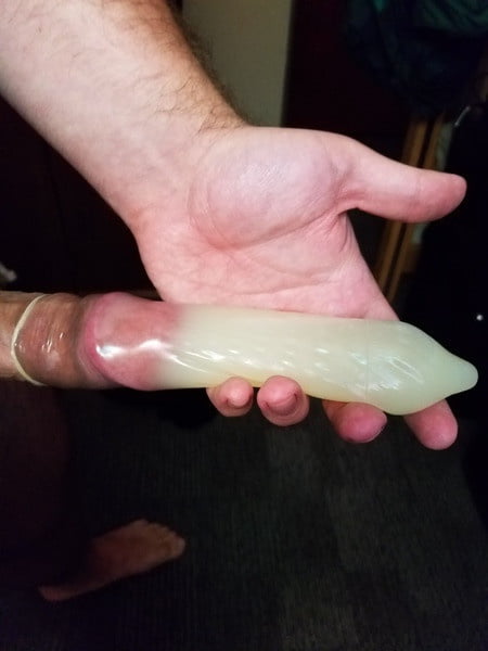 Filling A Condom With Cum.