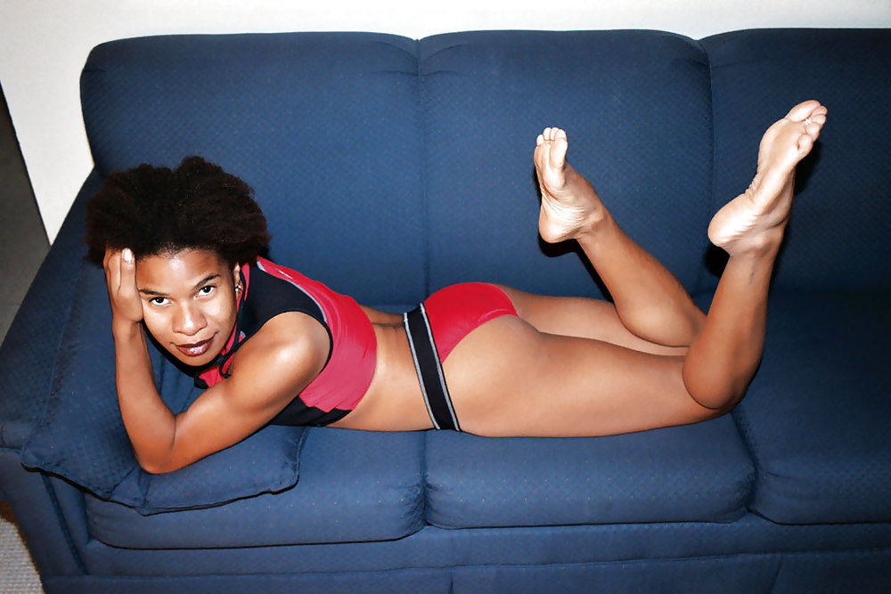 Sexy black woman spreads long legs