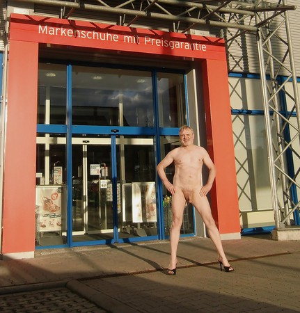 Naked in front of a shop