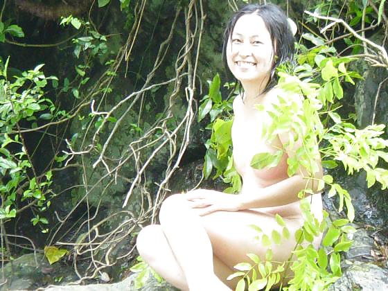 Free Asian girls at waterfall. photos