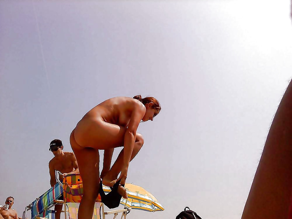 Free Sluts are changing at the beach photos