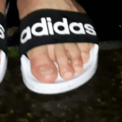 Adidas adilette sandals &amp; black socks outside