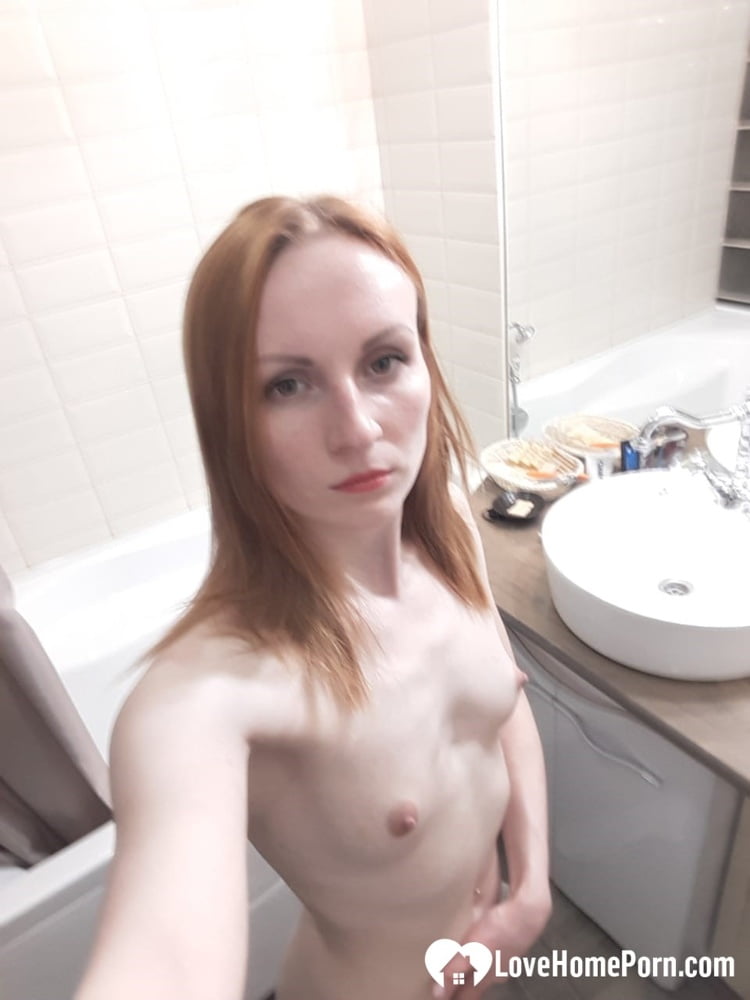 Skinny redhead with small tits in the mirror - 50 Pics 