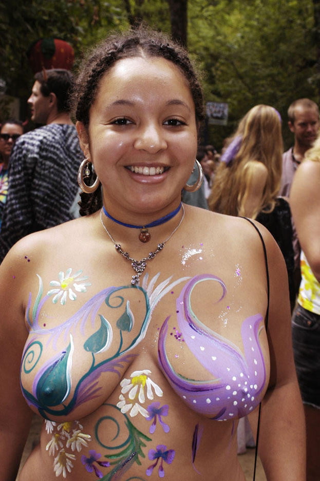 A bodypainted blonde with very big tits.