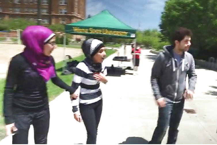 Free Veiled Arab slut kissing white dude photos