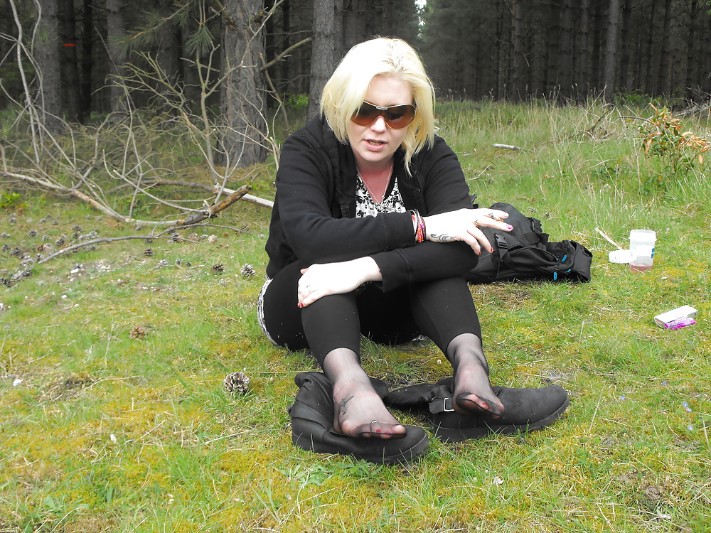 Free Em showing her sexy feet in the forest in black tights photos