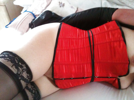 Sub slut in corset and armbinder