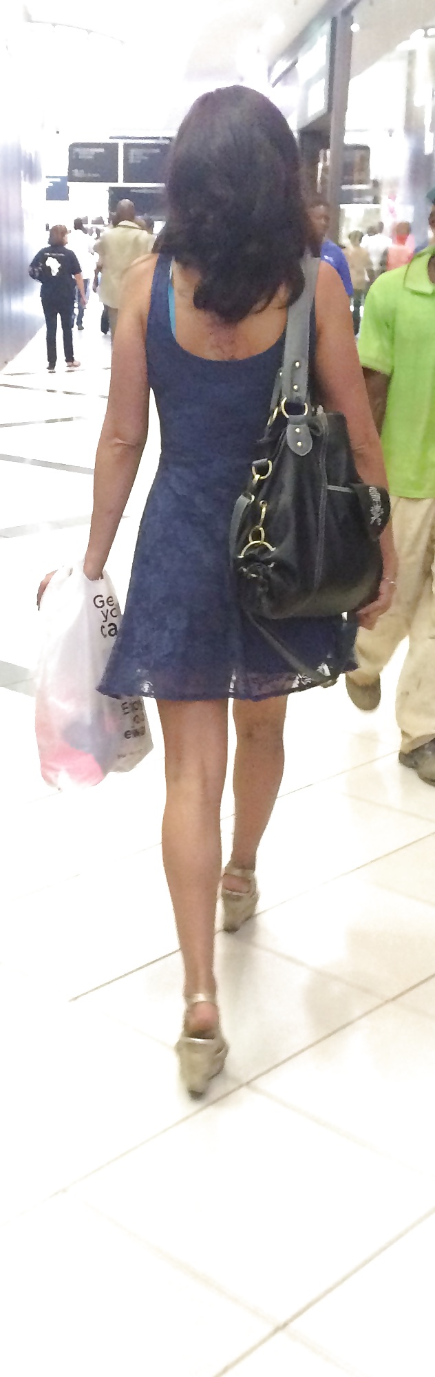 Free A mall milf with wonderful legs photos