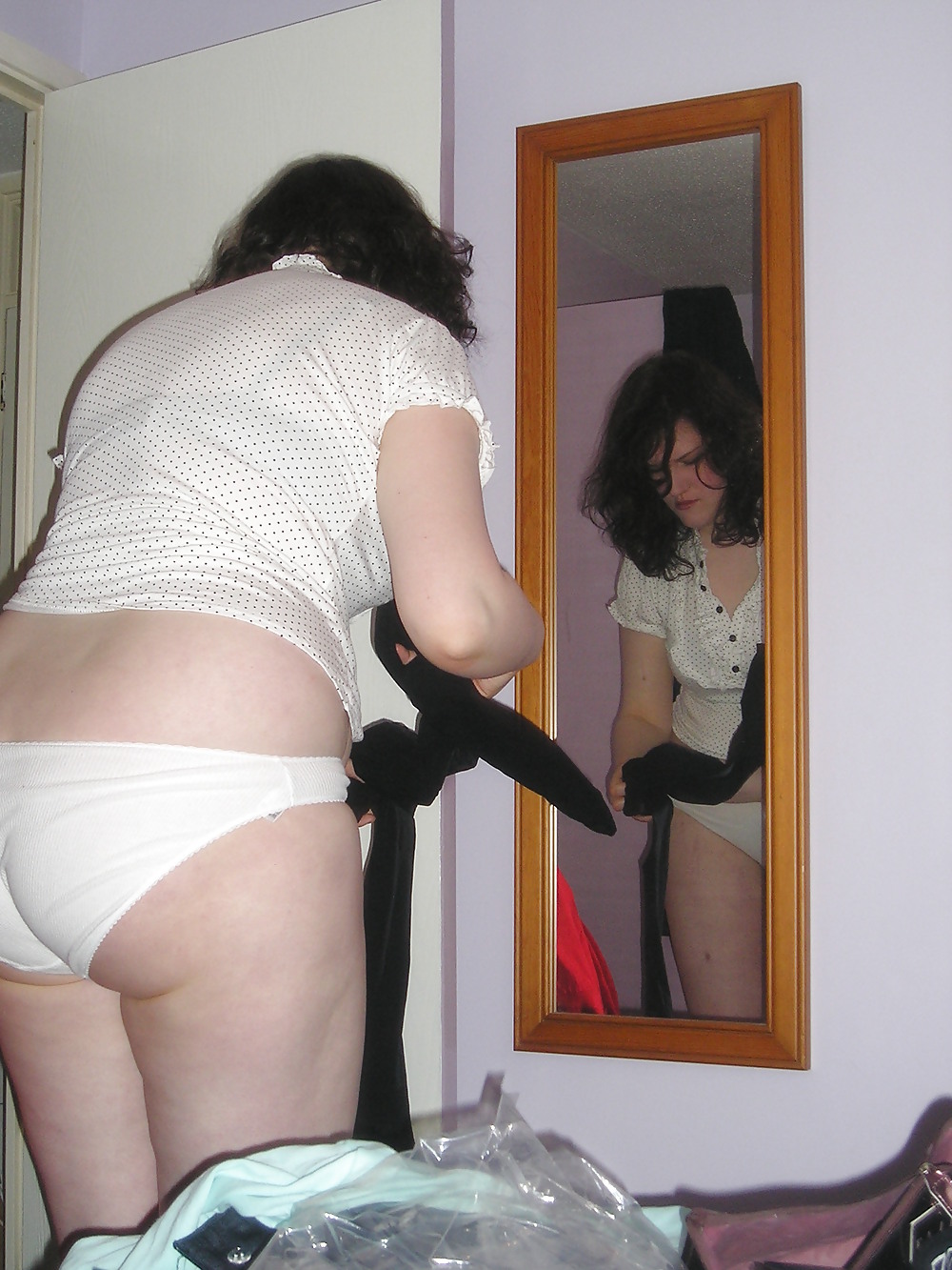 Free Shaven Slut getting dressed photos