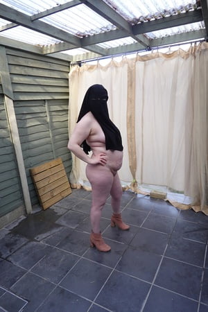 nude in niqab in ankle boots         