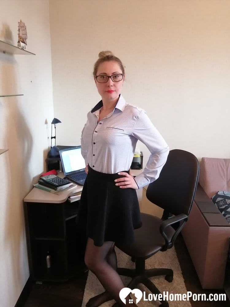 Office worker in black stockings shows her goods - 50 Photos 