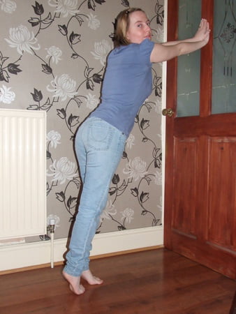 cute blonde posing in jeans and shirt         