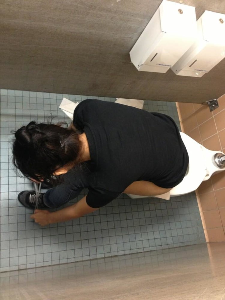 Spying over stall catching guy cumming in public bathroom