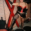 In latex paint outfit on the cross