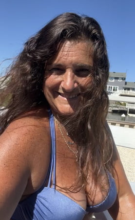 sunning in sexy purple bikini         