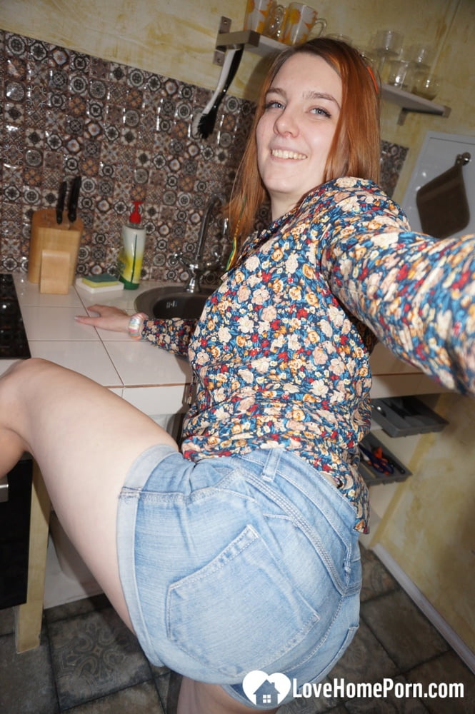 Cute redhead in socks shows off her body - 12 Photos 