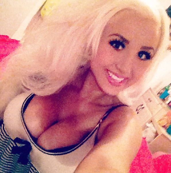 Free blonde bitch with big fake boobs photos
