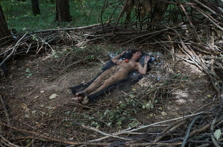 in forest cradle with apple         