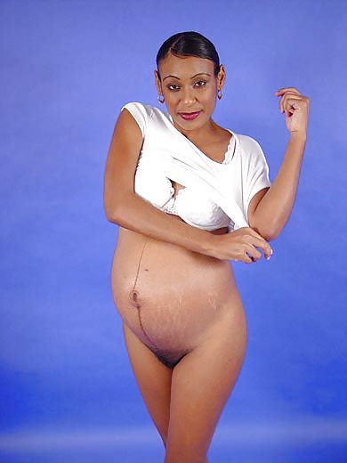 Free Pregnant black woman showing off photos