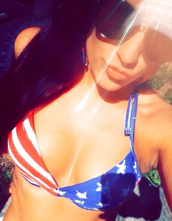Free Shows off her tanlined bum photos